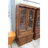 A MODERN OAK CABINET WITH GLAZED AND LEADED UPPER PORTION, 37" WIDE