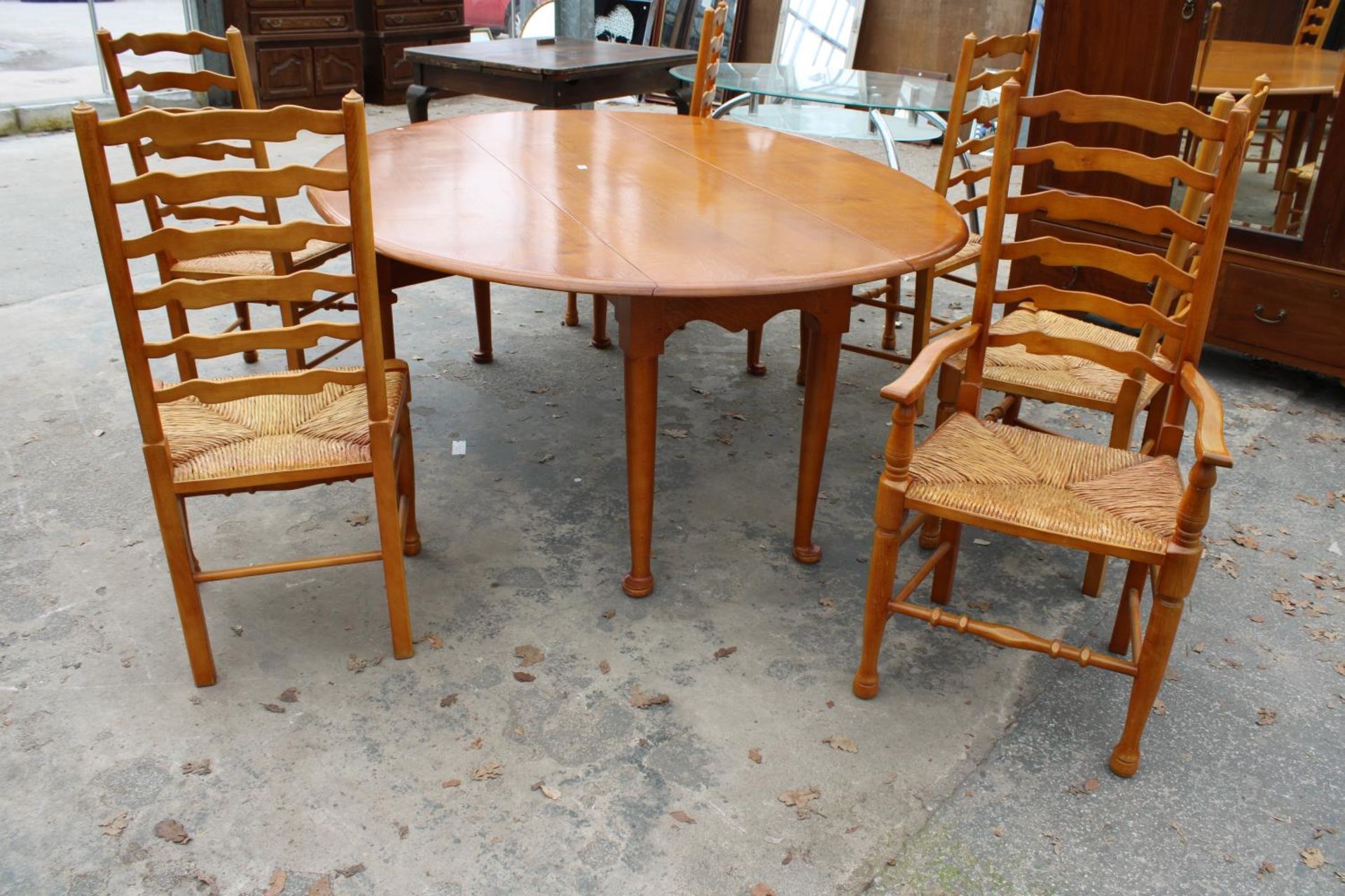 A GEORGIAN STYLE OVAL OAK WAKES TABLE, 77" X 59" OPENED AND SIX LADDER BACK DINING CHAIRS WITH - Image 9 of 9