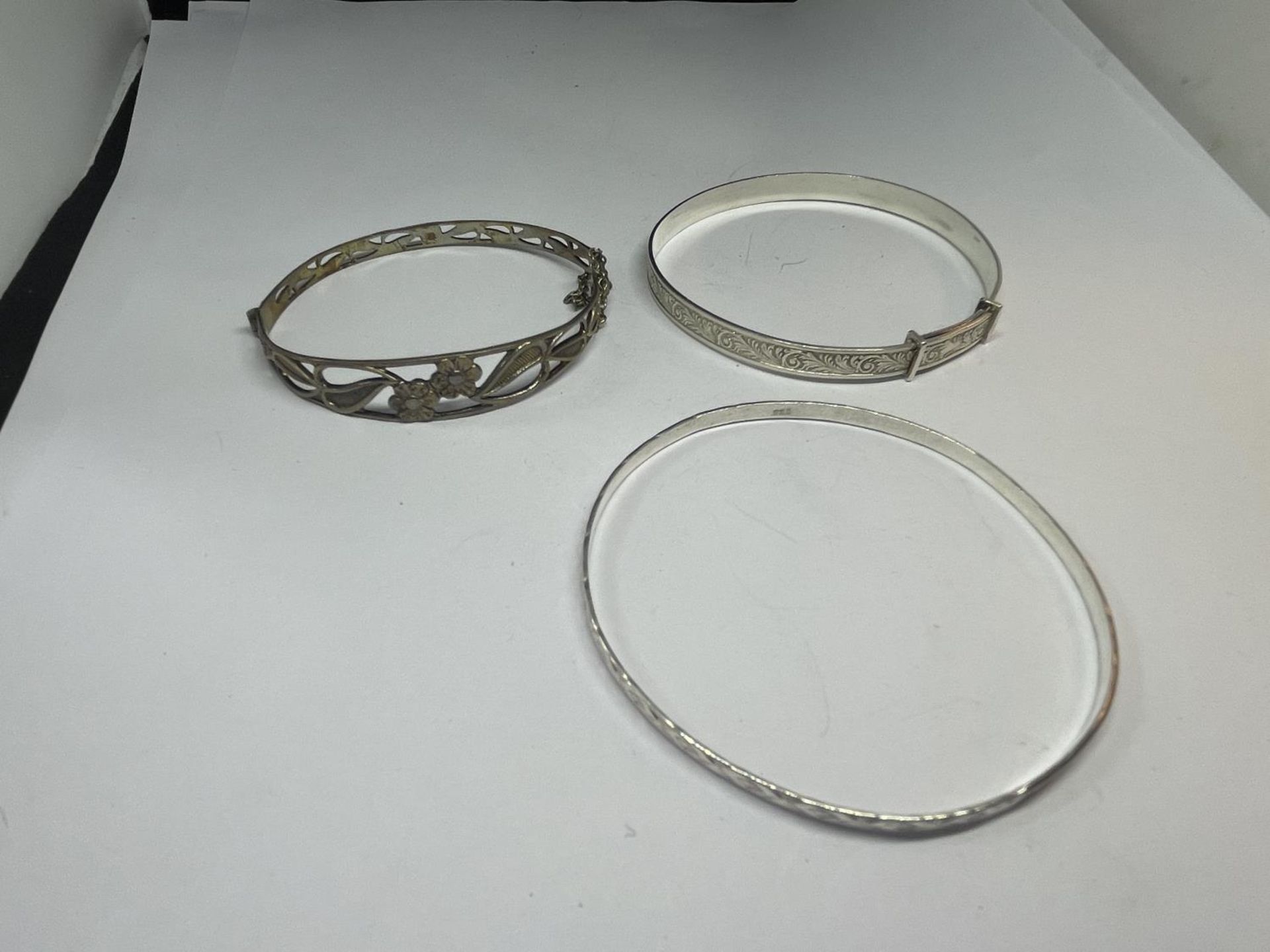 THREE SILVER BANGLES