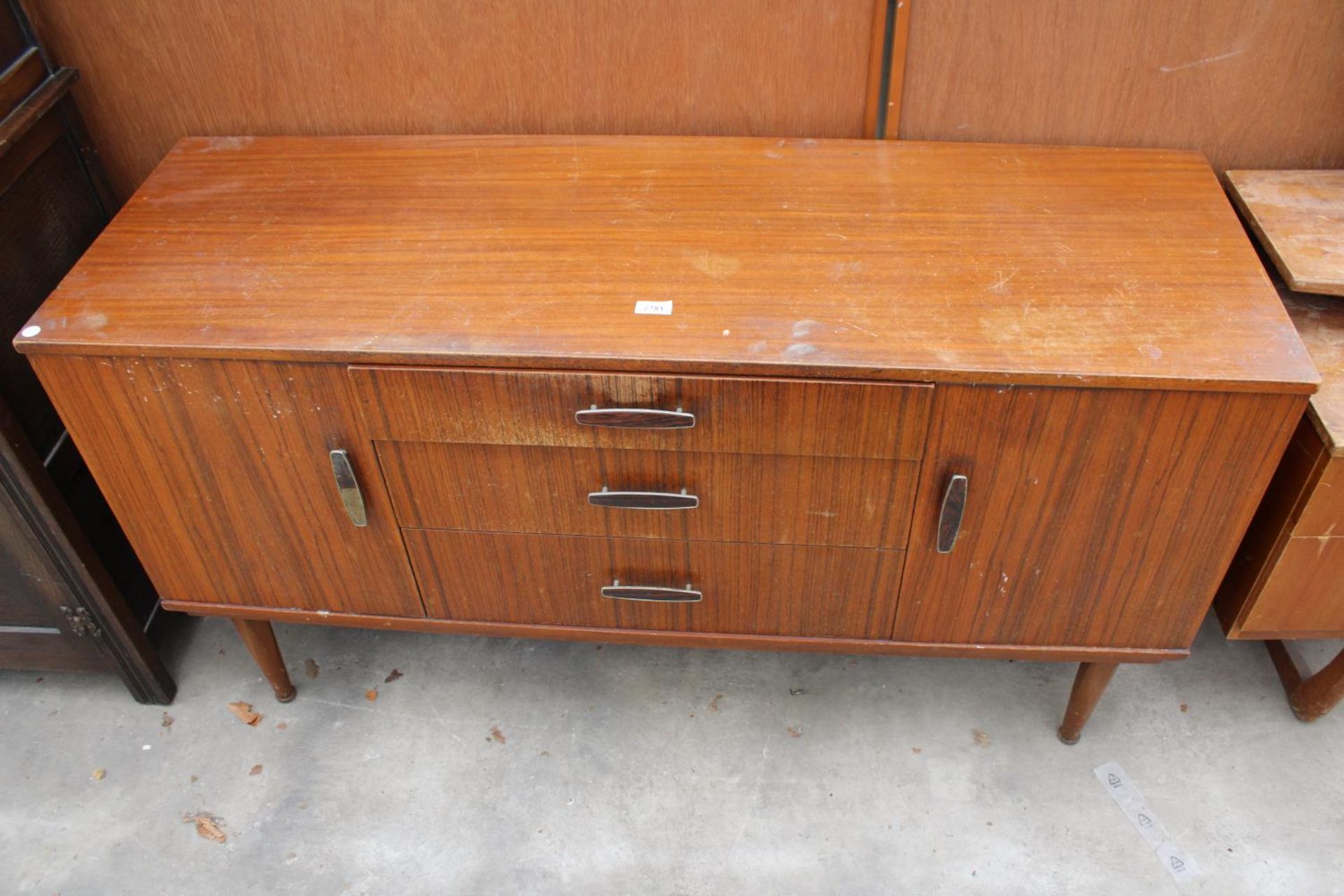 A RETRO TEAK SIDEBOARD ENCLOSING THREE DRAWERS AND TWO CUPBOARDS, 54" WIDE - Image 2 of 2
