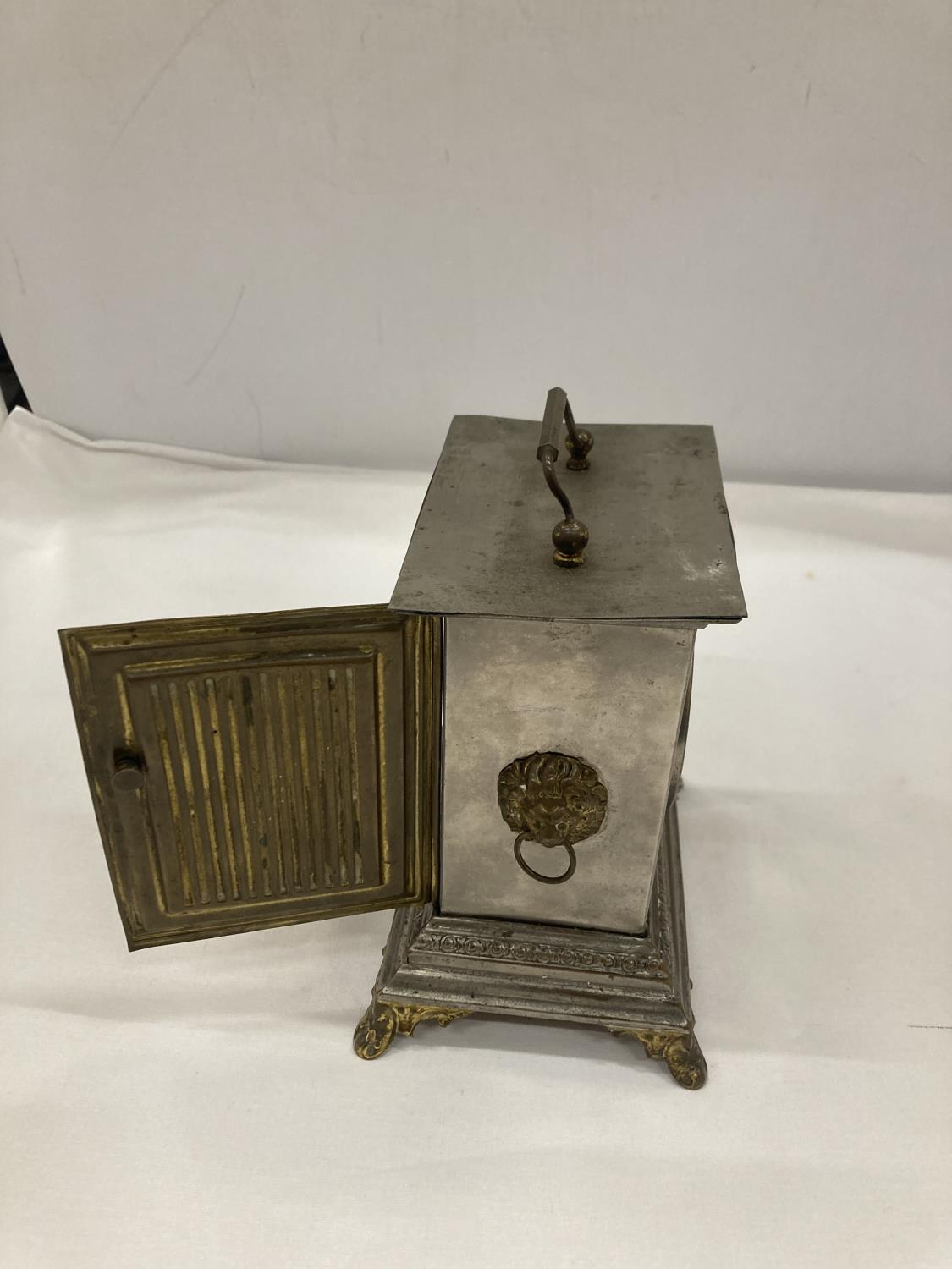 AN OFFICER'S ALARM CLOCK WITH BRASS DECORATION AND LION HEADS TO THE SIDE - Image 2 of 4