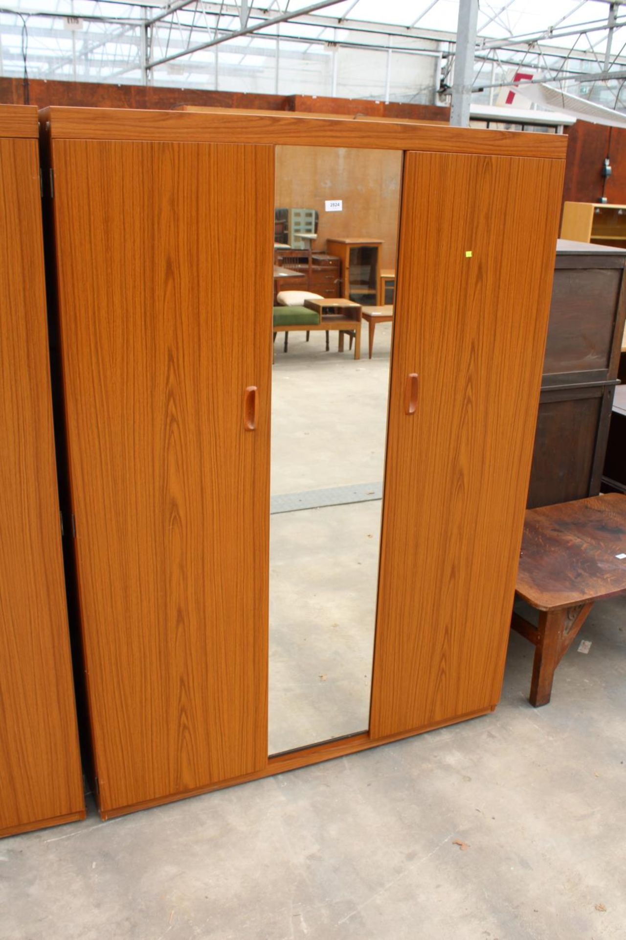 A RETRO SCHRIEBER TWO DOOR WARDROBE WITH MIRRORED CENTRAL SECTION, 47.5" WIDE