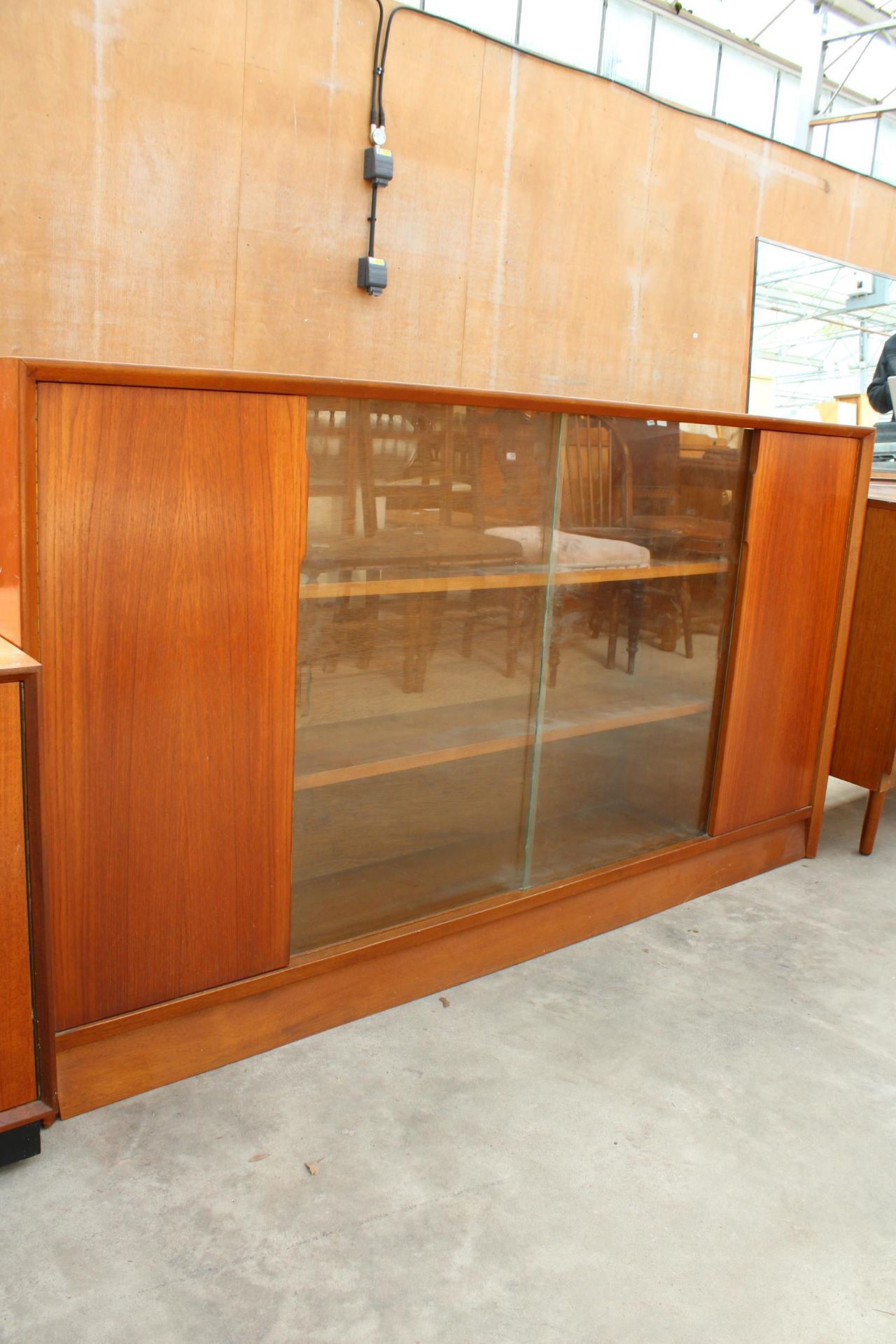 A MID CENTURY HERBERT E GIBBS, RETRO TEAK BOOKCASE WITH TWO GLASS SLIDING DOORS, WIDTH 153CM - Image 2 of 4