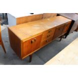 A RETRO TEAK SIDEBOARD/COCKTAIL CABINET, 72" WIDE