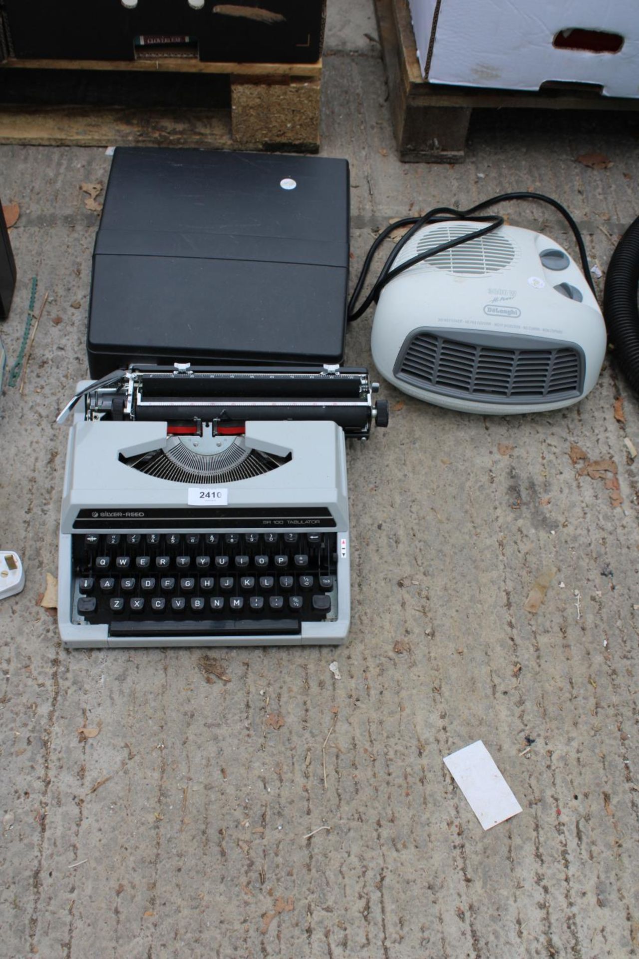 A SILVER-REED TYPEWRITER AND A HEATER