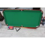 A TABLE TOP POOL TABLE, CUES AND BALLS ETC