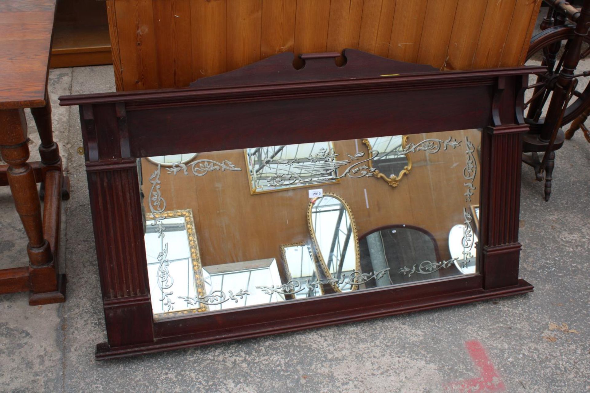 A MODERN MAHOGANY OVERMANTEL MIRROR, 52" X 30"