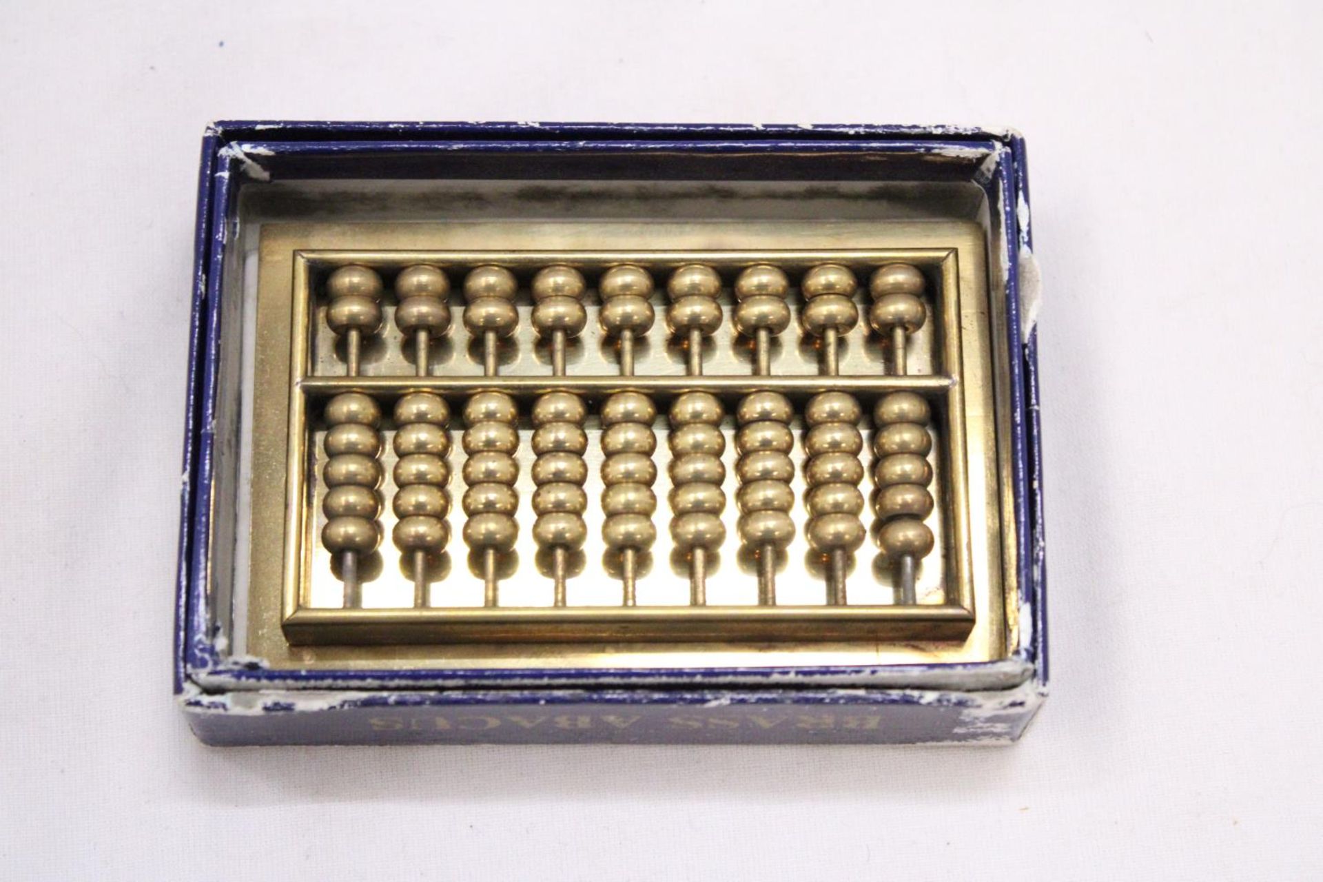 A SMALL VINTAGE HEAVY BRASS ABACUS