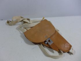 A LEATHER SHOULDER HOLSTER