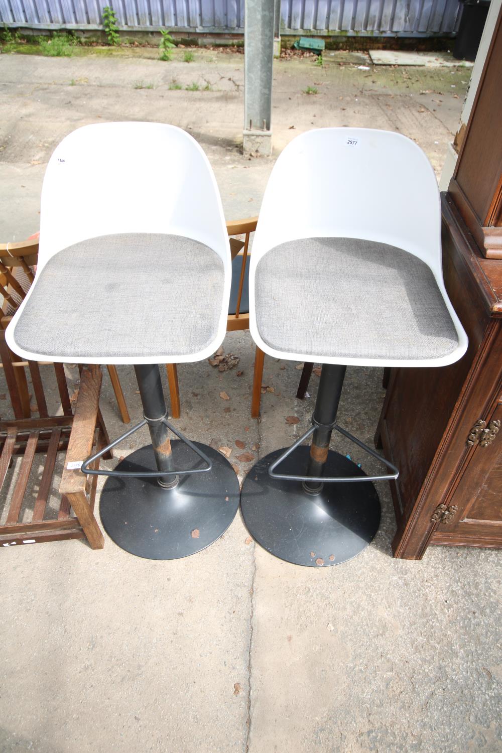 A PAIR OF MODERN HIGH BACK PUMP STOOLS