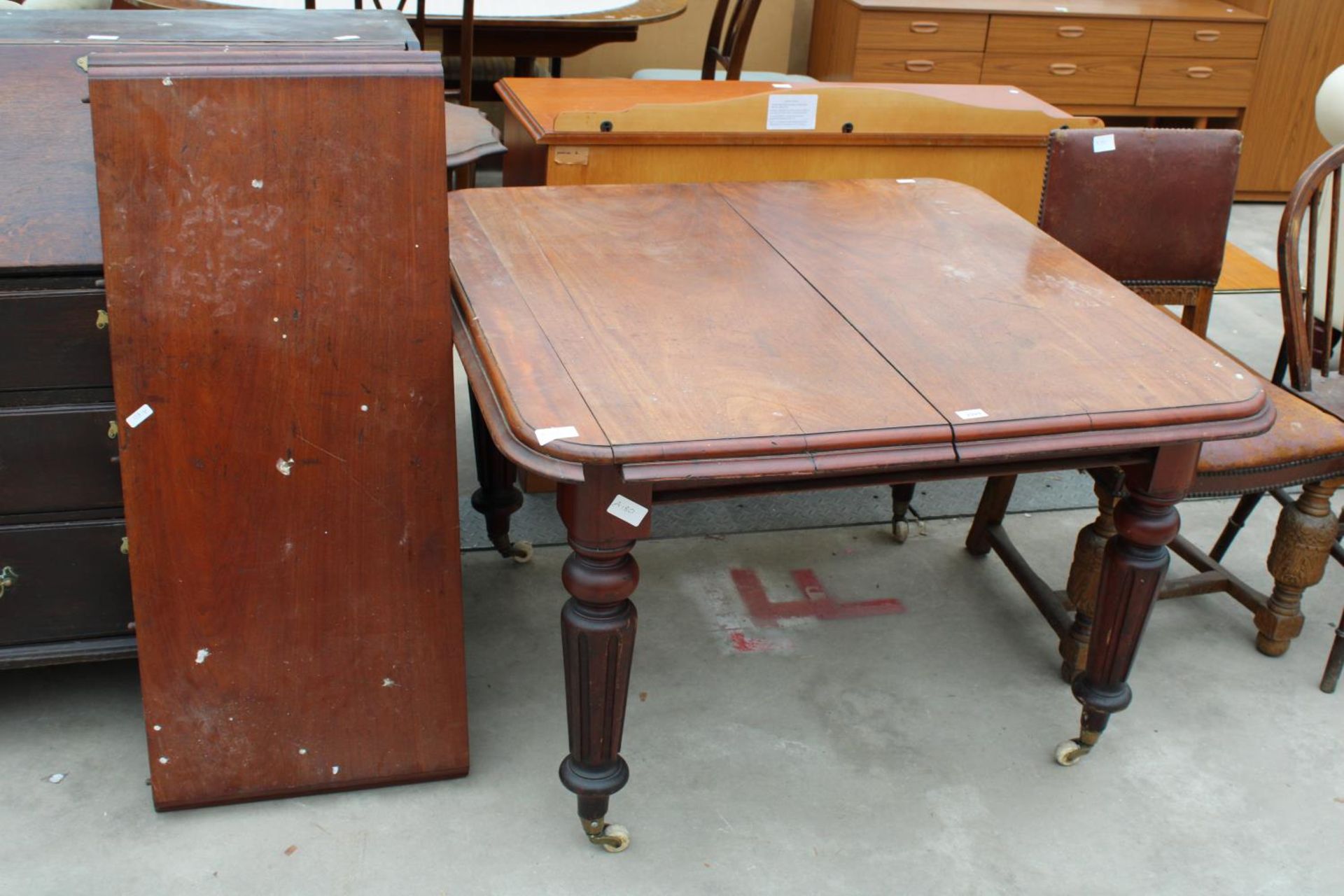 A VICTORIAN MAHOGANY WIND-OUT DINING TABLE ON TURNED AND FLUTED LEGS, 43" SQUARE (LEAF 18")