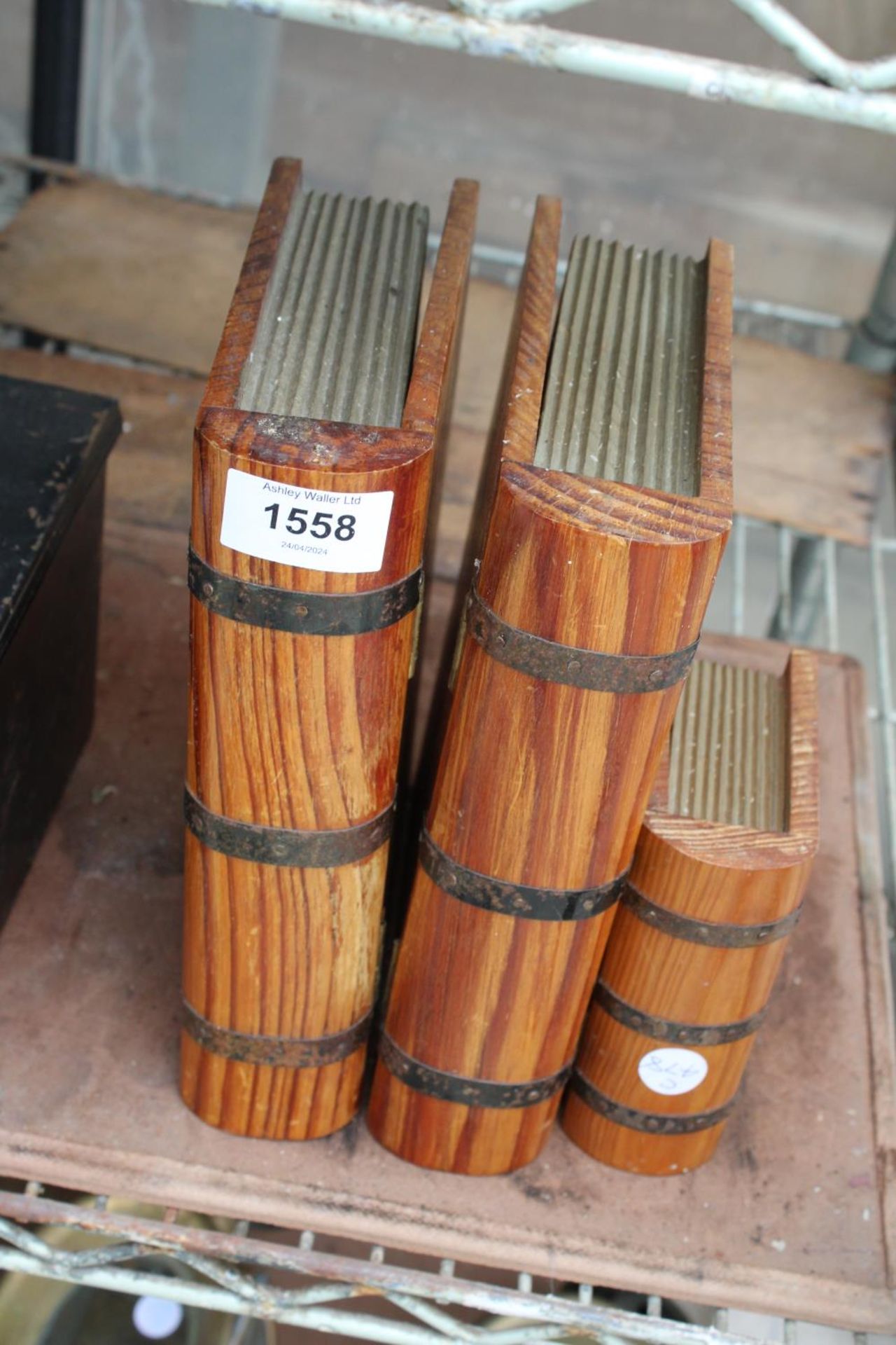 THREE WOODEN AND METAL BANDED BOXES IN THE FORM OF BOOKS