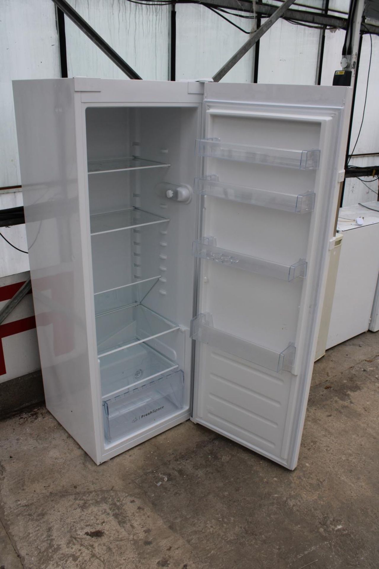 A WHITE INDESIT UPRIGHT FRIDGE BELIEVED IN WORKING ORDER BUT NO WARRANTY - Image 2 of 2