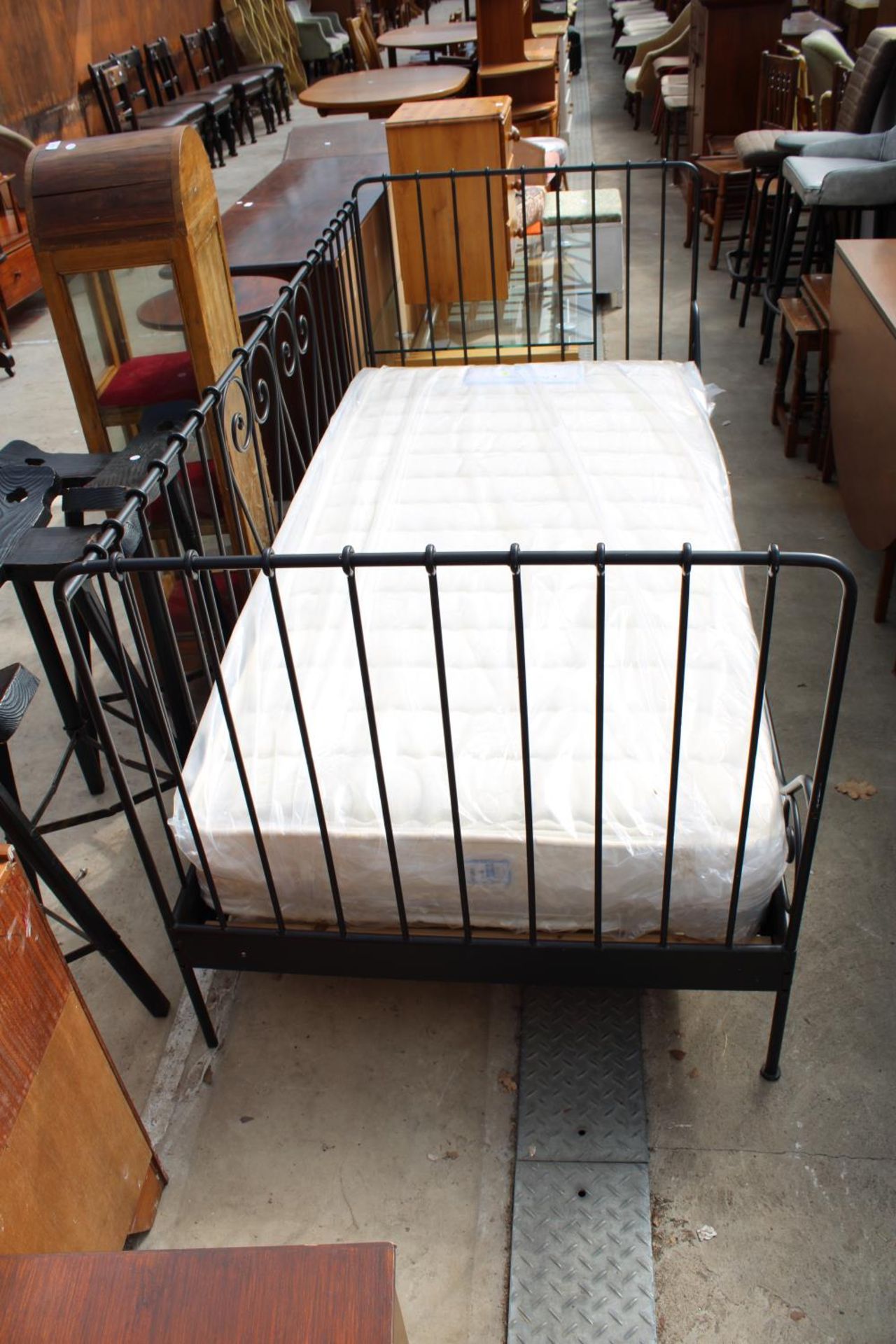 A MODERN 3' TUBULAR BED FRAME WITH POSTUREPEDIC BONANZA MATTRESS
