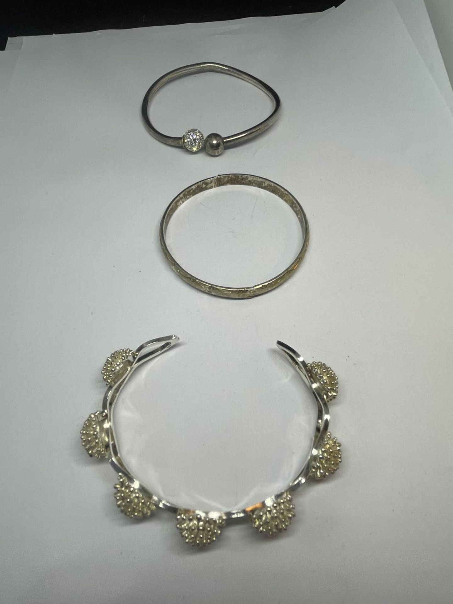 THREE SILVER BANGLES