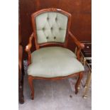 A CONTINENTAL STYLE OPEN ARM CHAIR