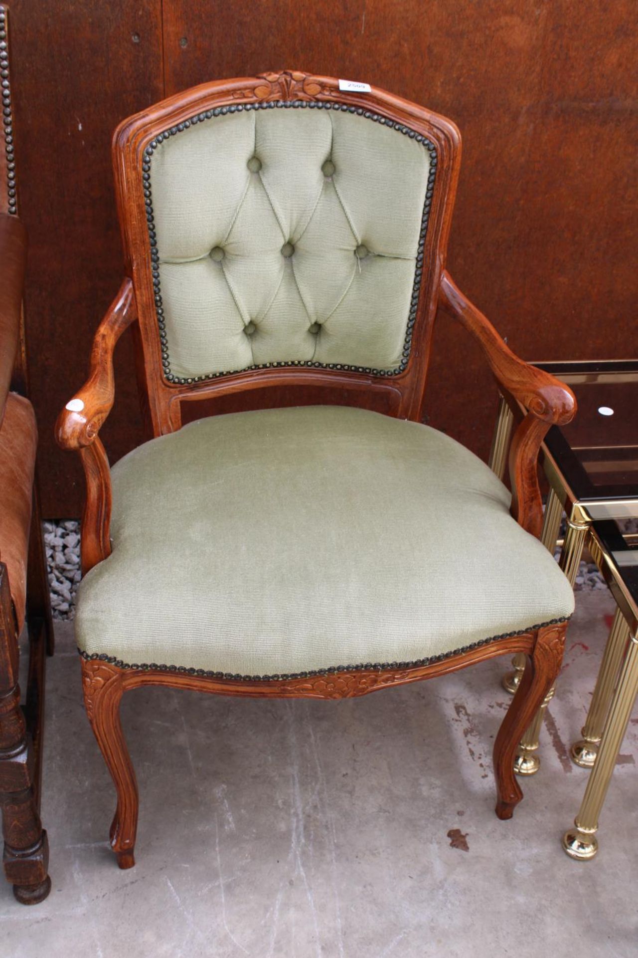 A CONTINENTAL STYLE OPEN ARM CHAIR