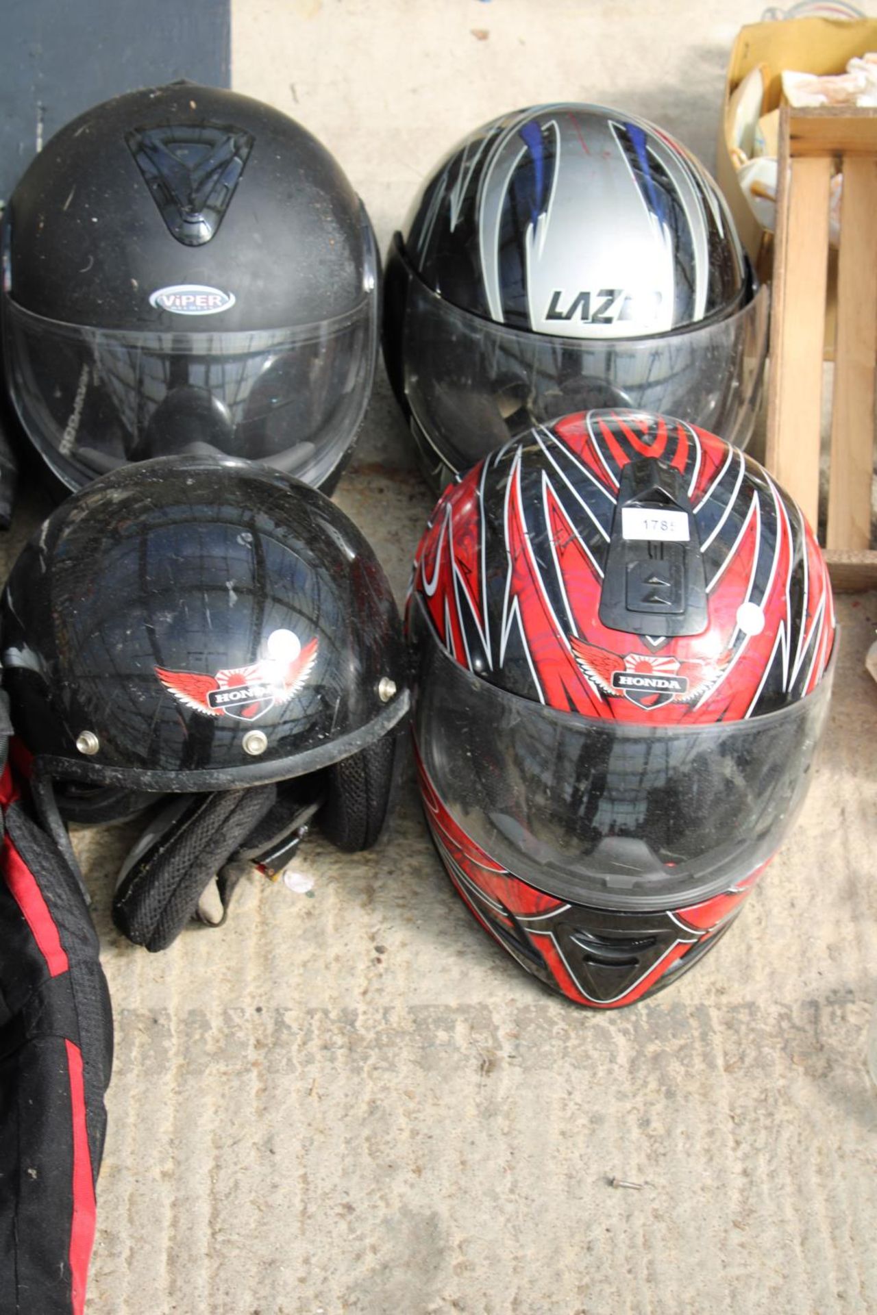 A MOTORBIKE JACKET AND FOUR HELMETS - Image 2 of 2