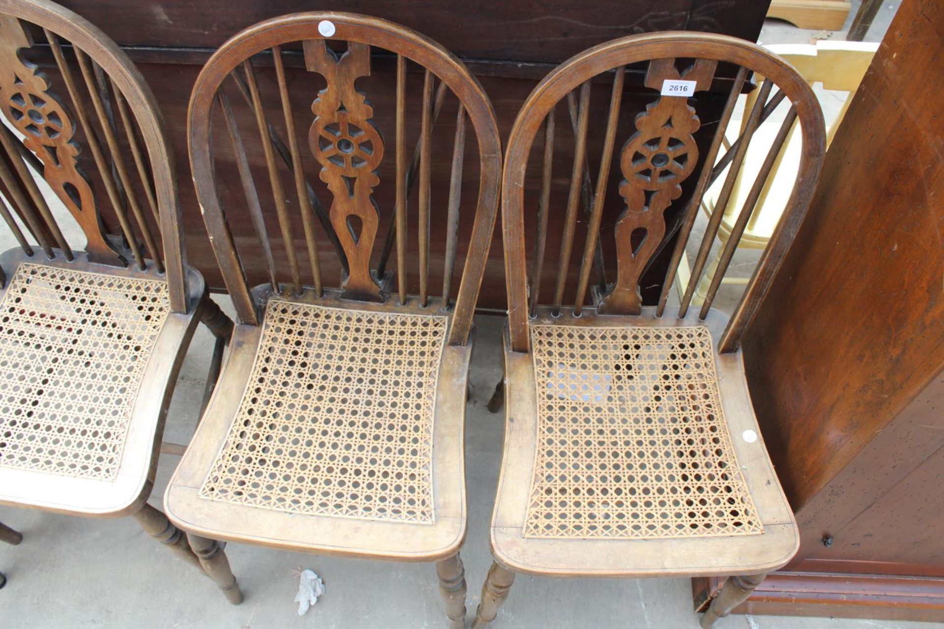 THREE WINDSOR STYLE WHEEL-BACK DINING CHAIRS WITH SPLIT CANE SEATS - Image 2 of 2