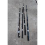 FOUR FIBREGLASS FISHING RODS TO INCLUDE AN ELEVEN FOOT AQUARIAN ROD, ETC