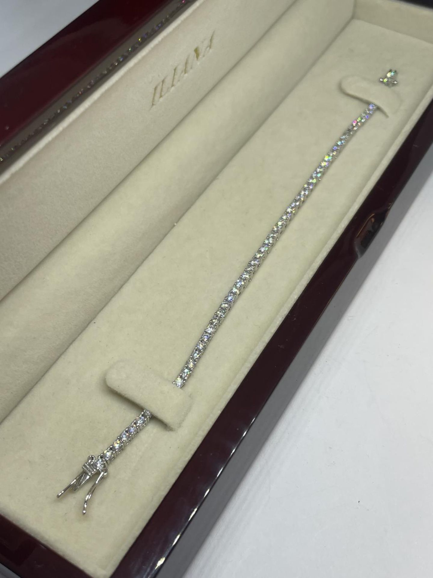 A SILVER BRACELET IN A PRESENTATION BOX