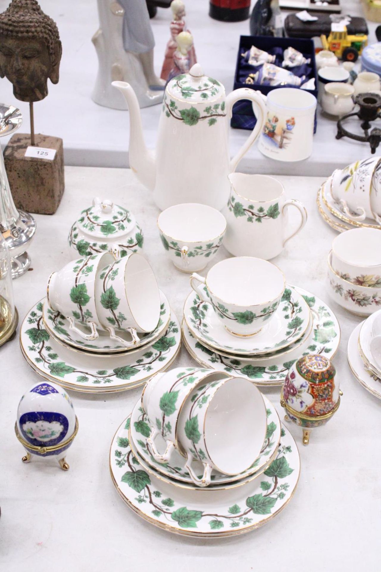 A "CROWN STAFFORDSHIRE" - GREEN IVY TEASET SET TO INCLUDE CUPS, SAUCERS, JUG AND SUGAR BOWL WITH A