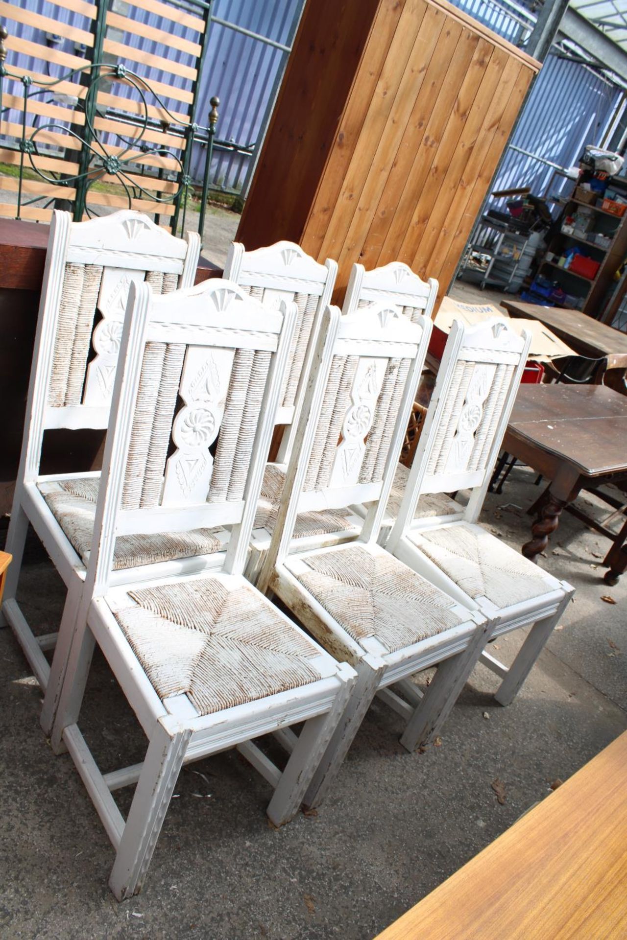 A SET OF SIX CHABBY CHIC DINING CHAIRS WITH RUSH SEATS AND BACKS