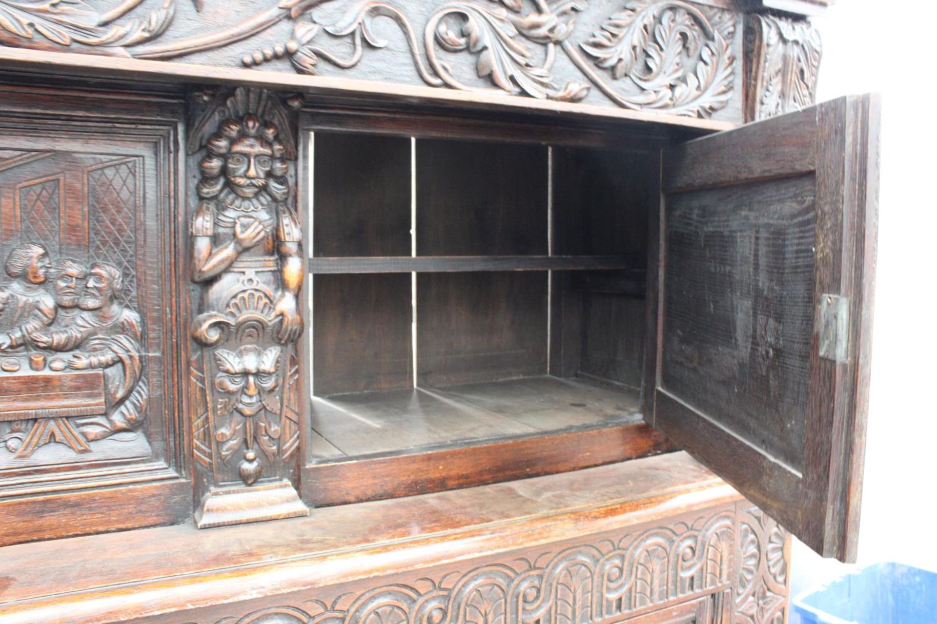 AN OAK GEORGE III STYLE COURT CUPBOARD WITH CARVED PANELS, THREE DEPICTING THE BIRTH AND - Image 13 of 13