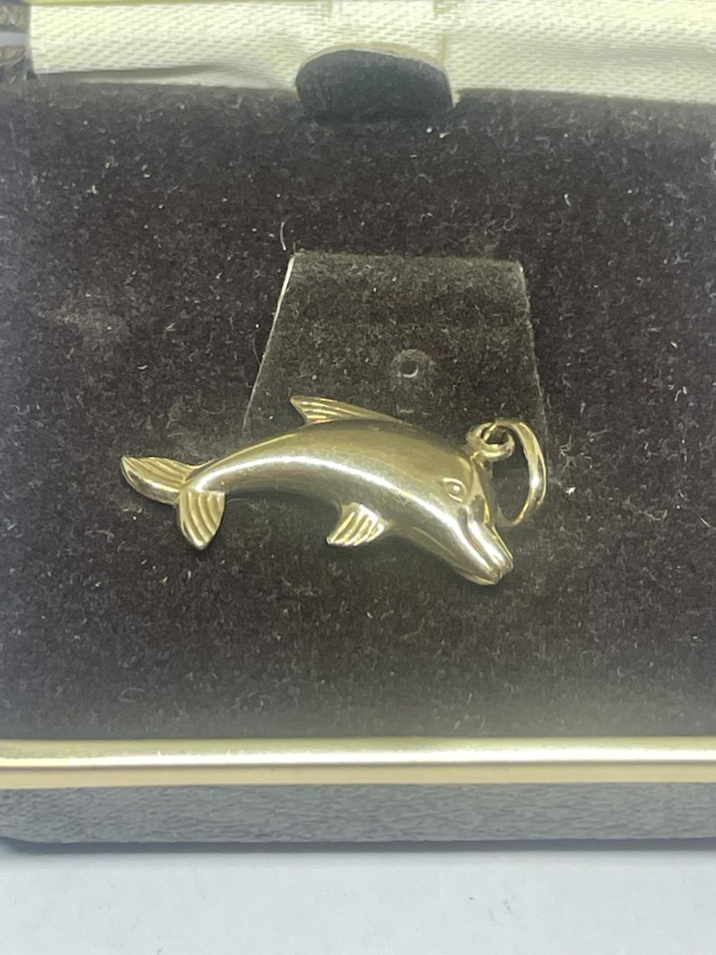 A 9 CARAT GOLD DOLPHIN PENDANT