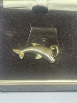 A 9 CARAT GOLD DOLPHIN PENDANT