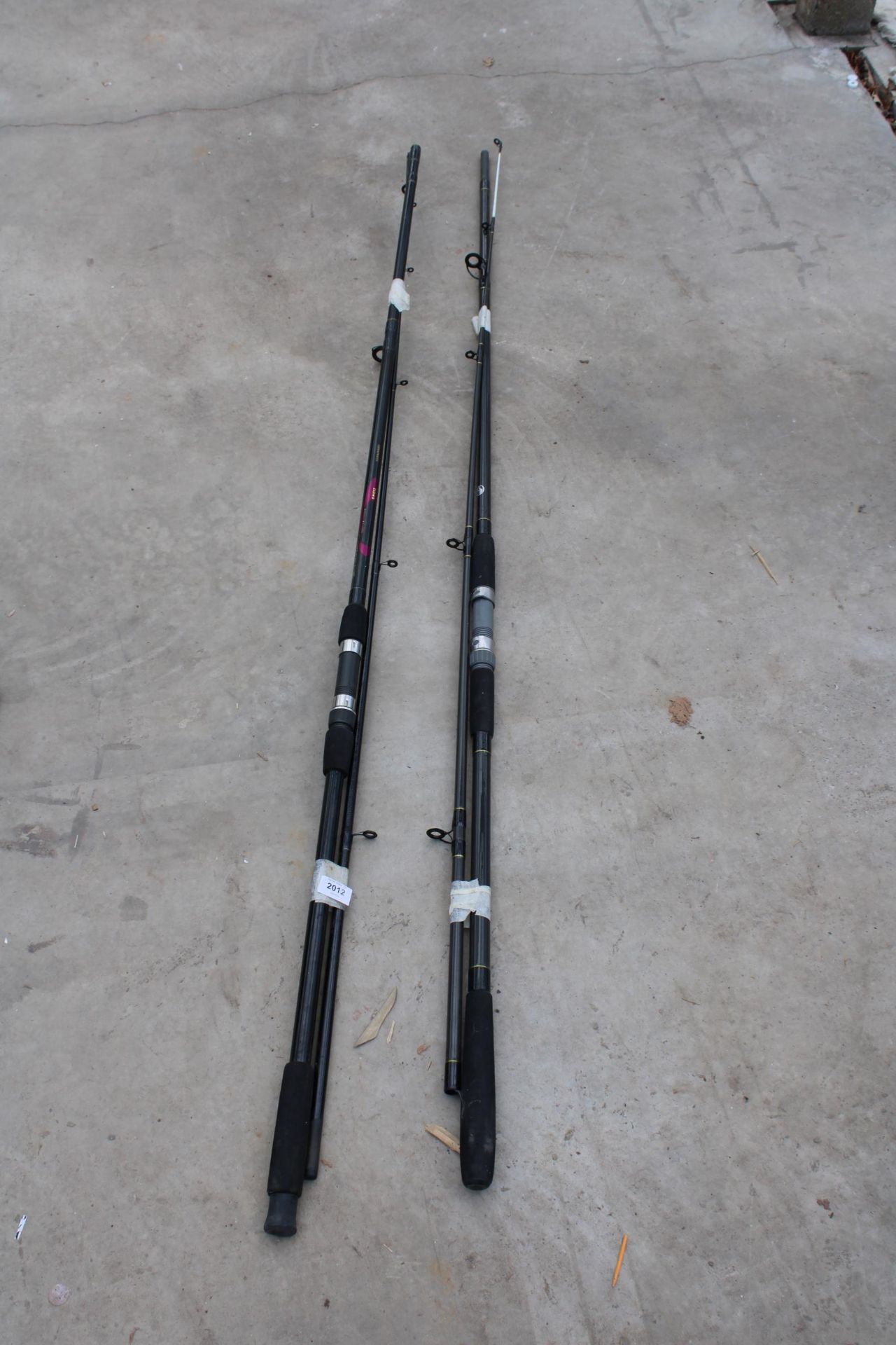 TWO CARP FISHING RODS TO INCLUDE AN ELEVEN FOOT CARBON STORM ROD AND A DAIWA GRAPHITE ROD
