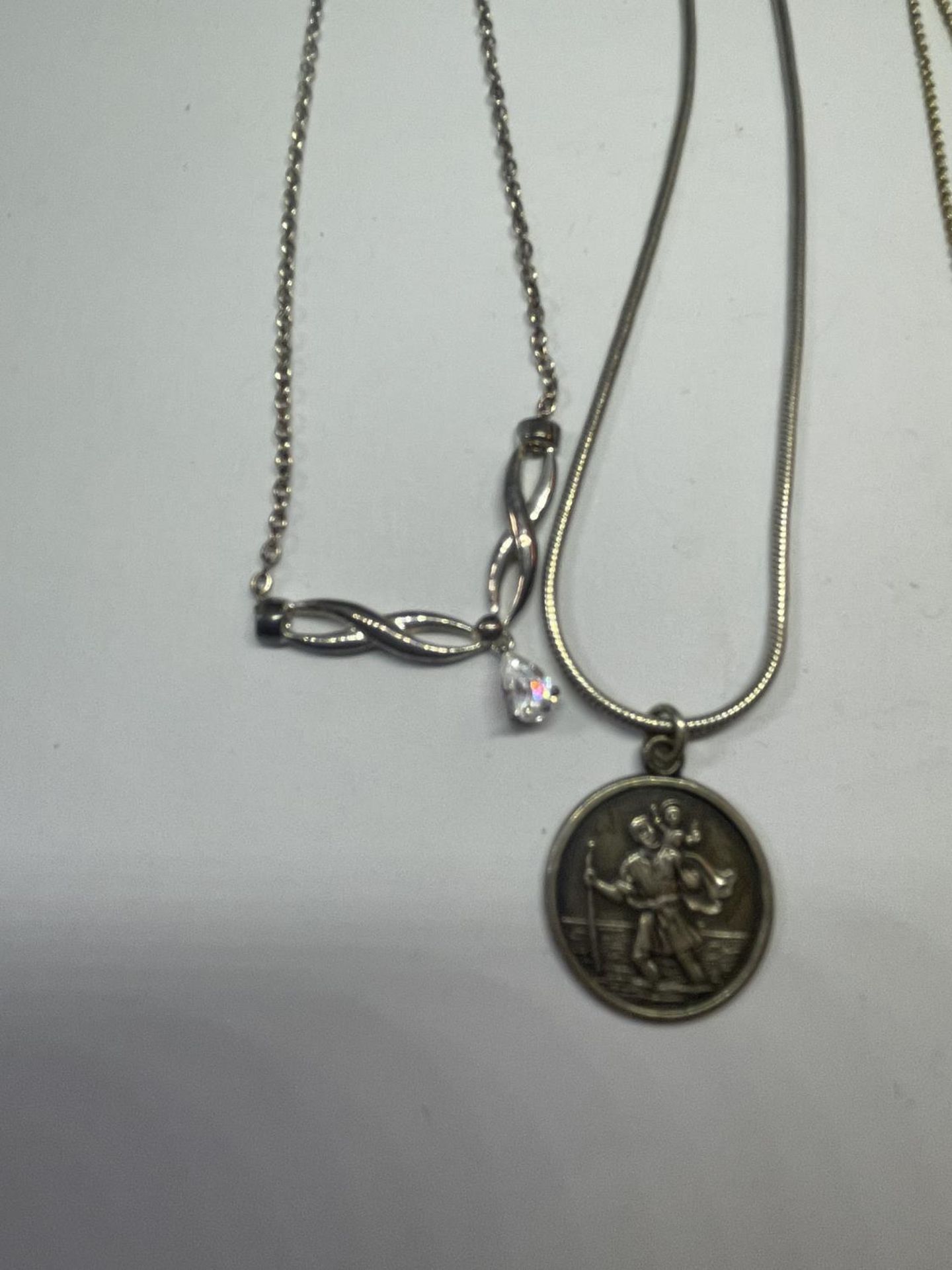 FOUR SILVER NECKLACES WITH PENDANTS - Image 2 of 3