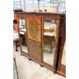 AN EDWARDIAN MAHOGANY DOUBLE MIRROR-DOOR WARDROBE ENCLOSING CUPBOARDS AND FOUR GRADUATED DRAWERS,