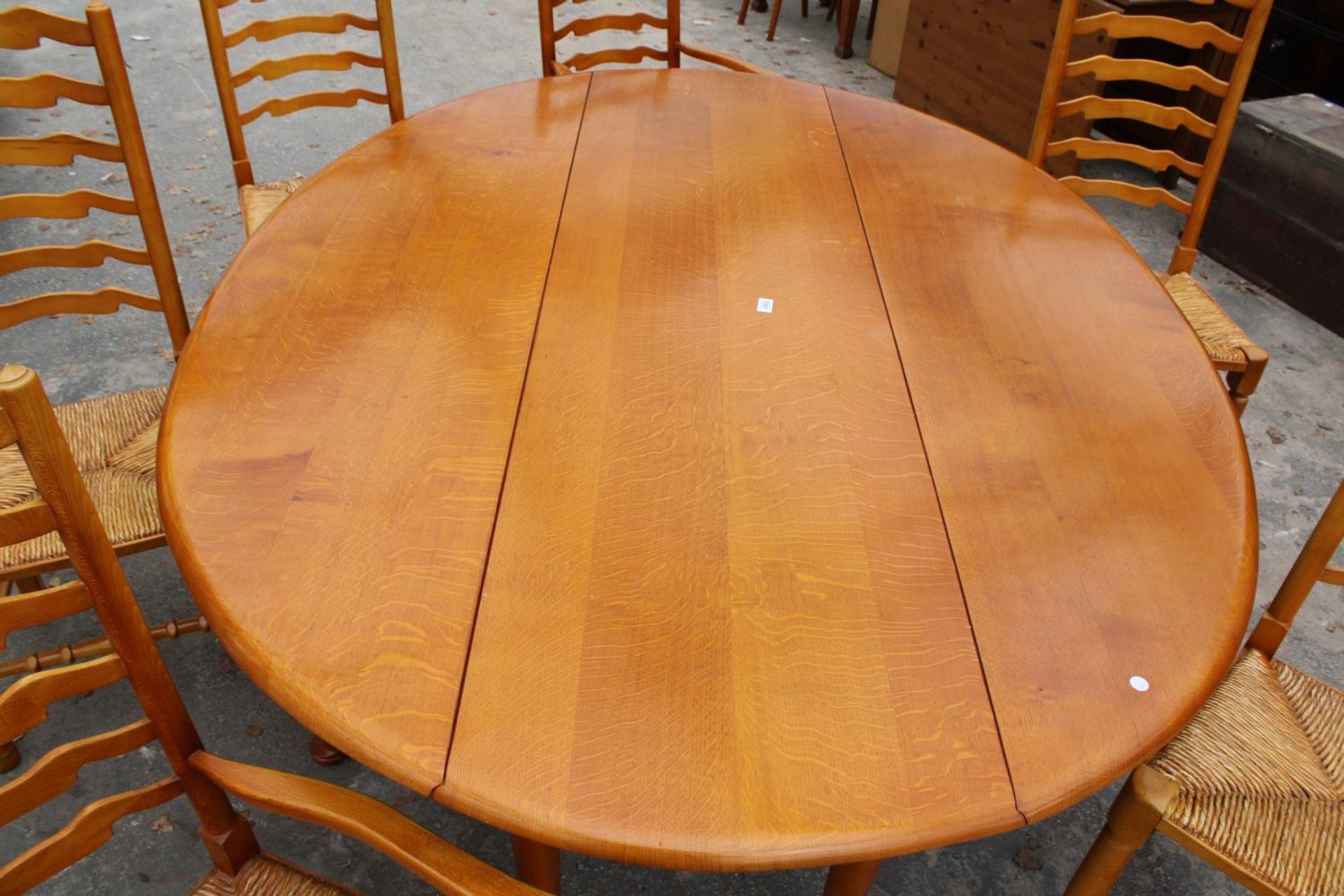 A GEORGIAN STYLE OVAL OAK WAKES TABLE, 77" X 59" OPENED AND SIX LADDER BACK DINING CHAIRS WITH - Image 5 of 9