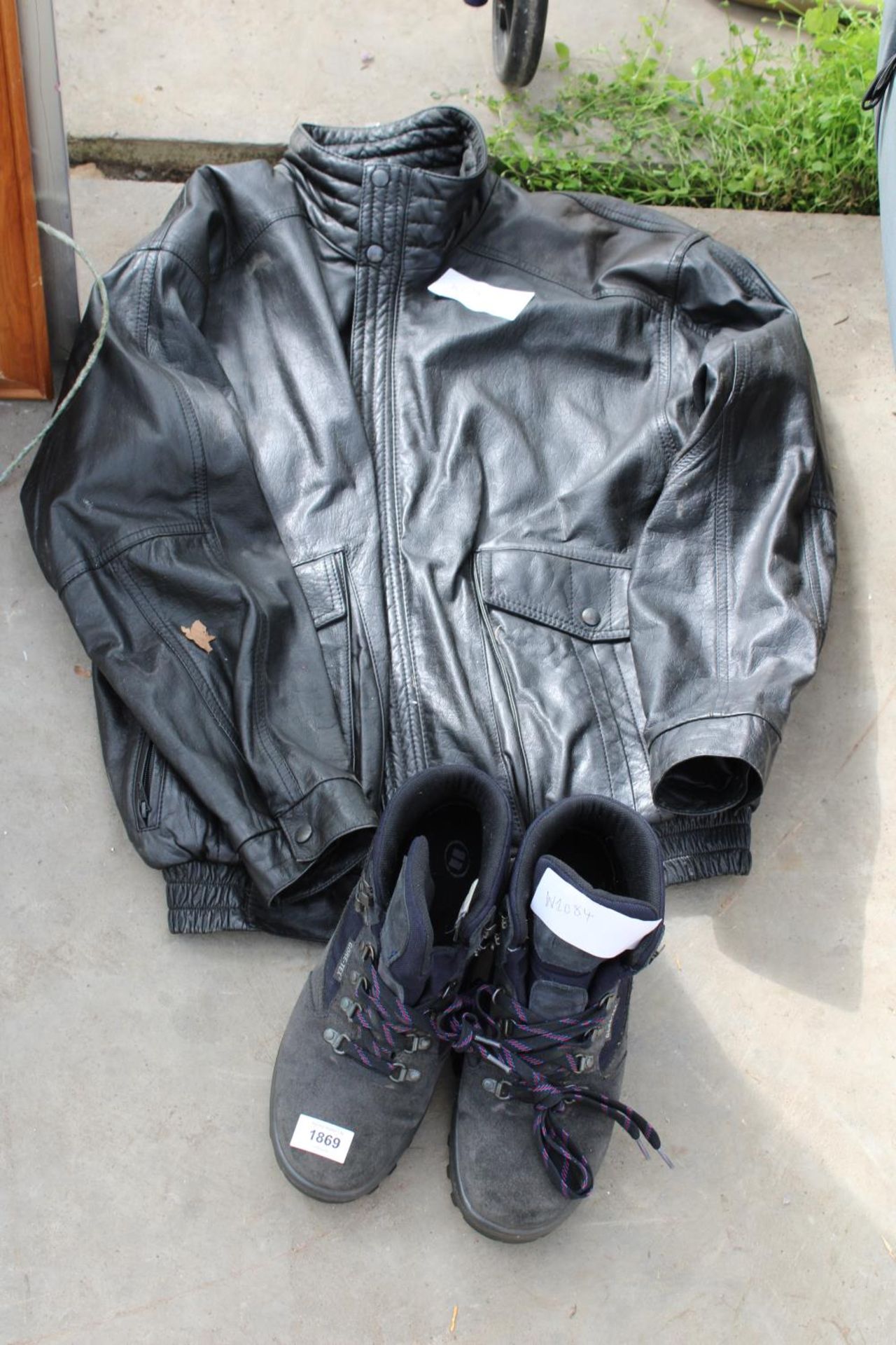 A LEATHER JACKET AND A PAIR OF GORE-TEX BOOTS