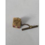 A HALLMARKED 9CT GOLD DIAMOND AND RUBY FODEN TRUCKS PIN BADGE GROSS WEIGHT 4.84 G