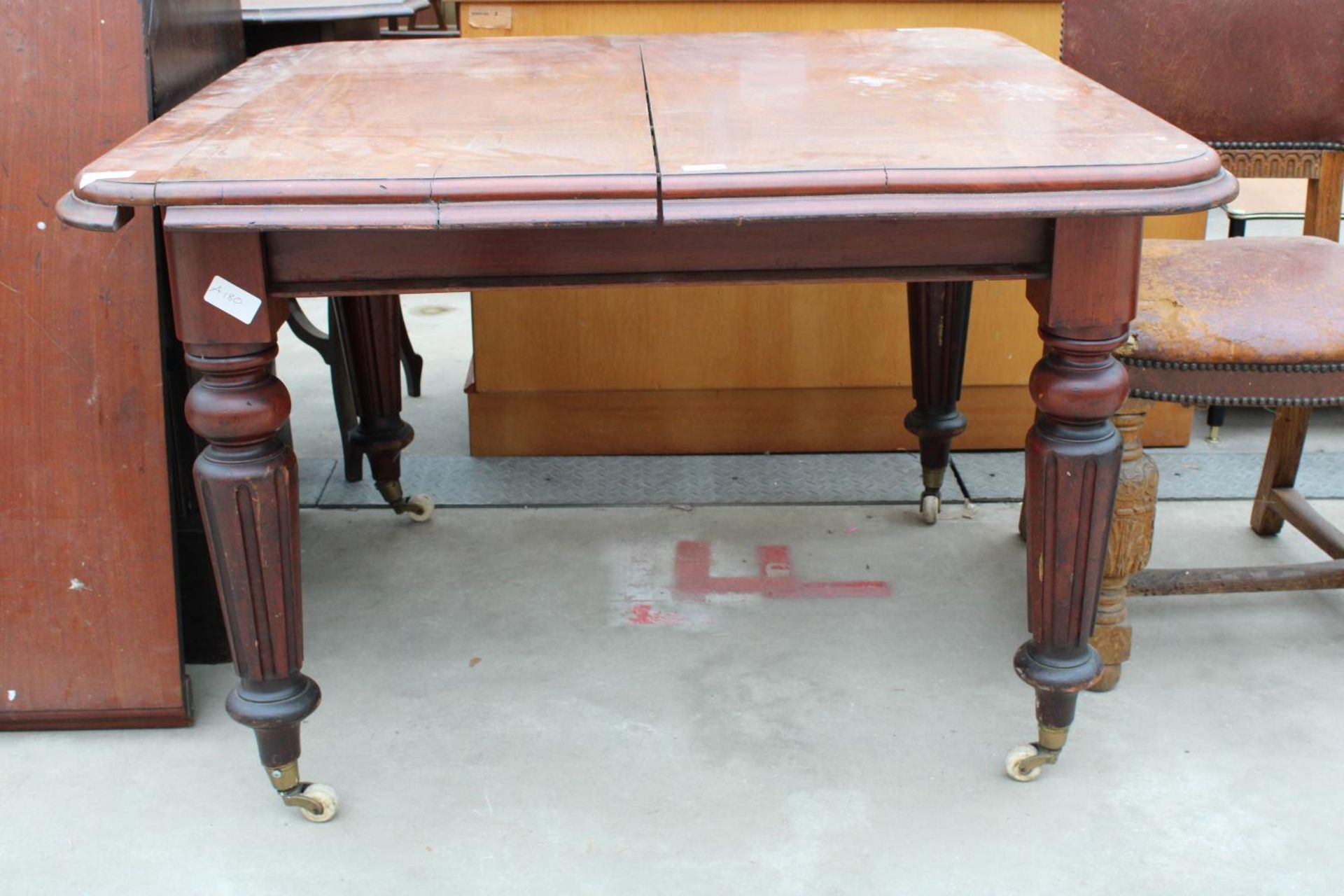 A VICTORIAN MAHOGANY WIND-OUT DINING TABLE ON TURNED AND FLUTED LEGS, 43" SQUARE (LEAF 18") - Image 2 of 2