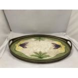AN ART NOUVEAU STYLE BRASS AND CERAMIC TRAY WITH GALLERIED SIDES ADORNED WITH FLOWERS AND LEAVES