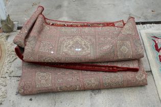 A LARGE VINTAGE RED PATTERNED RUG