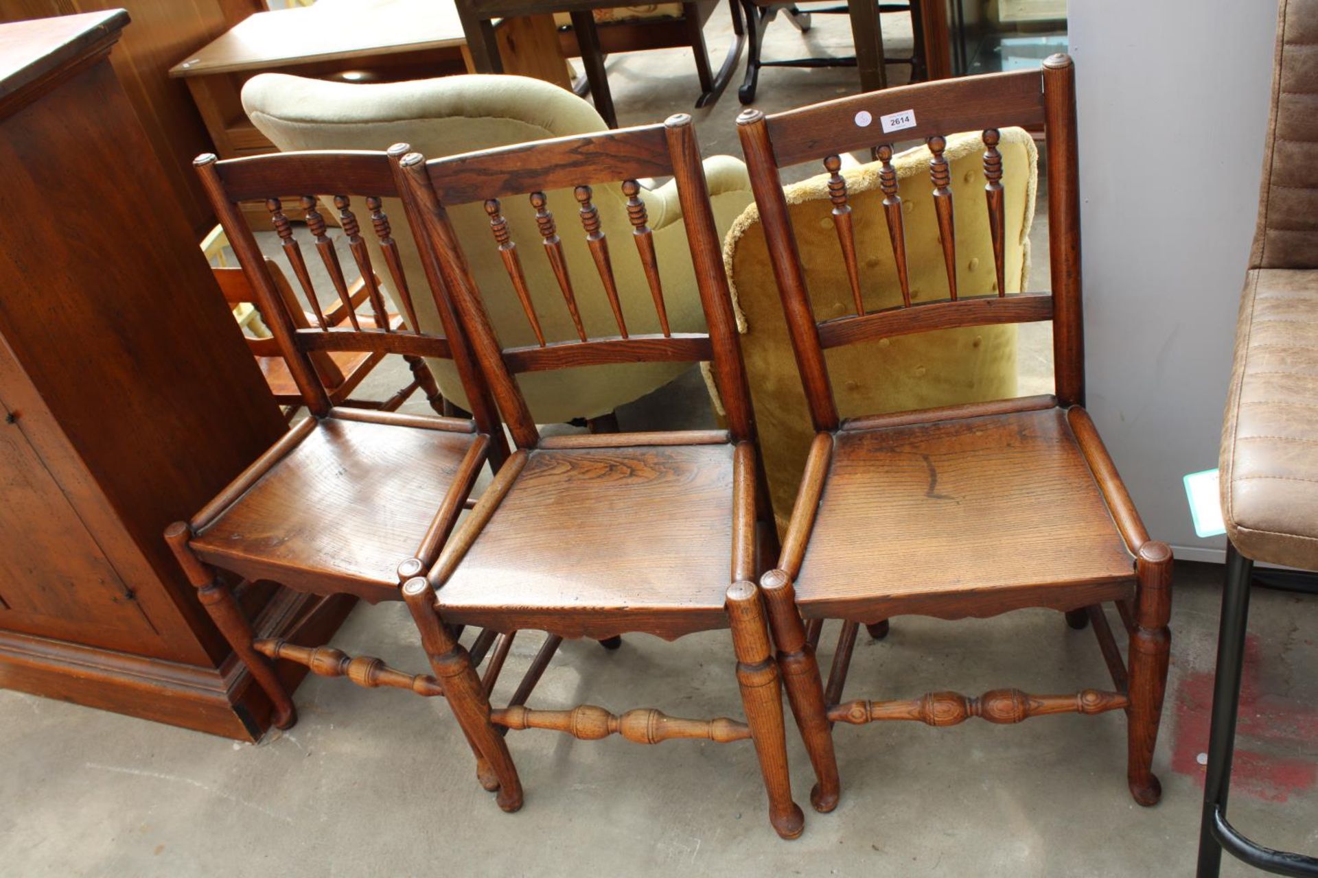 THREE 19TH CENTURY ELM DINING CHAIRS WITH TURNED SPINDLES AND SOLID SEATS