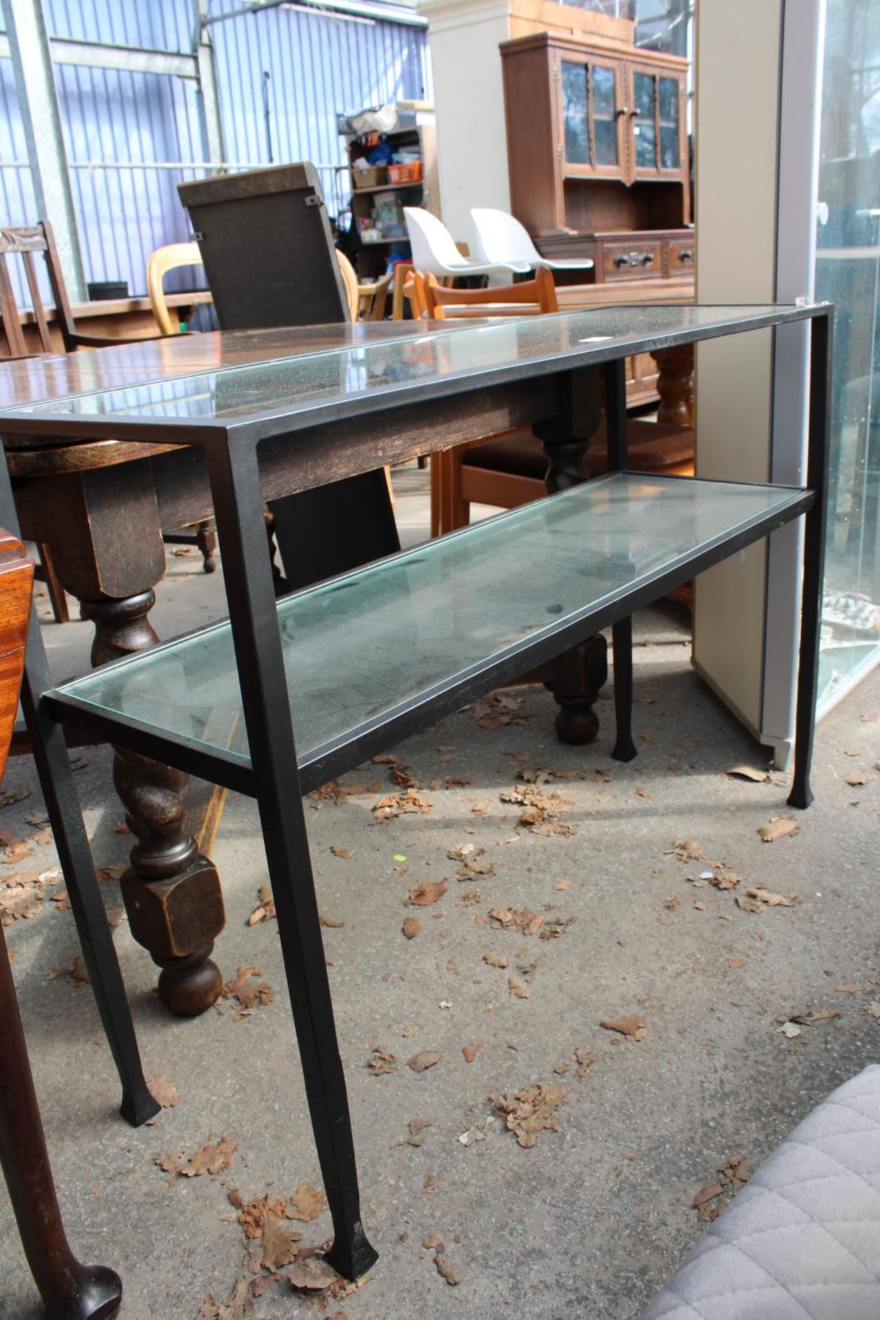 A MODERN BLACK METAL FRAME 2 TIER SIDE-TABLE WITH INSET GLASS TOP AND SHELF, 42" WIDE - Image 2 of 2