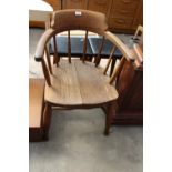 AN EARLY 20TH CENTURY ELM CAPTAINS STYLE CHAIR