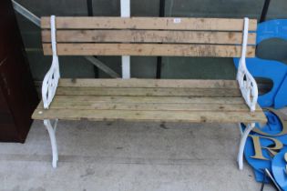 A WOODEN SLATTED GARDEN BENCH WITH CAST BENCH ENDS