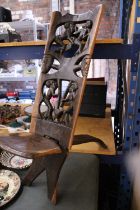 A VERY HEAVY CARVED AFRICAN BIRTHING CHAIR -APPROXIMATELY 91M