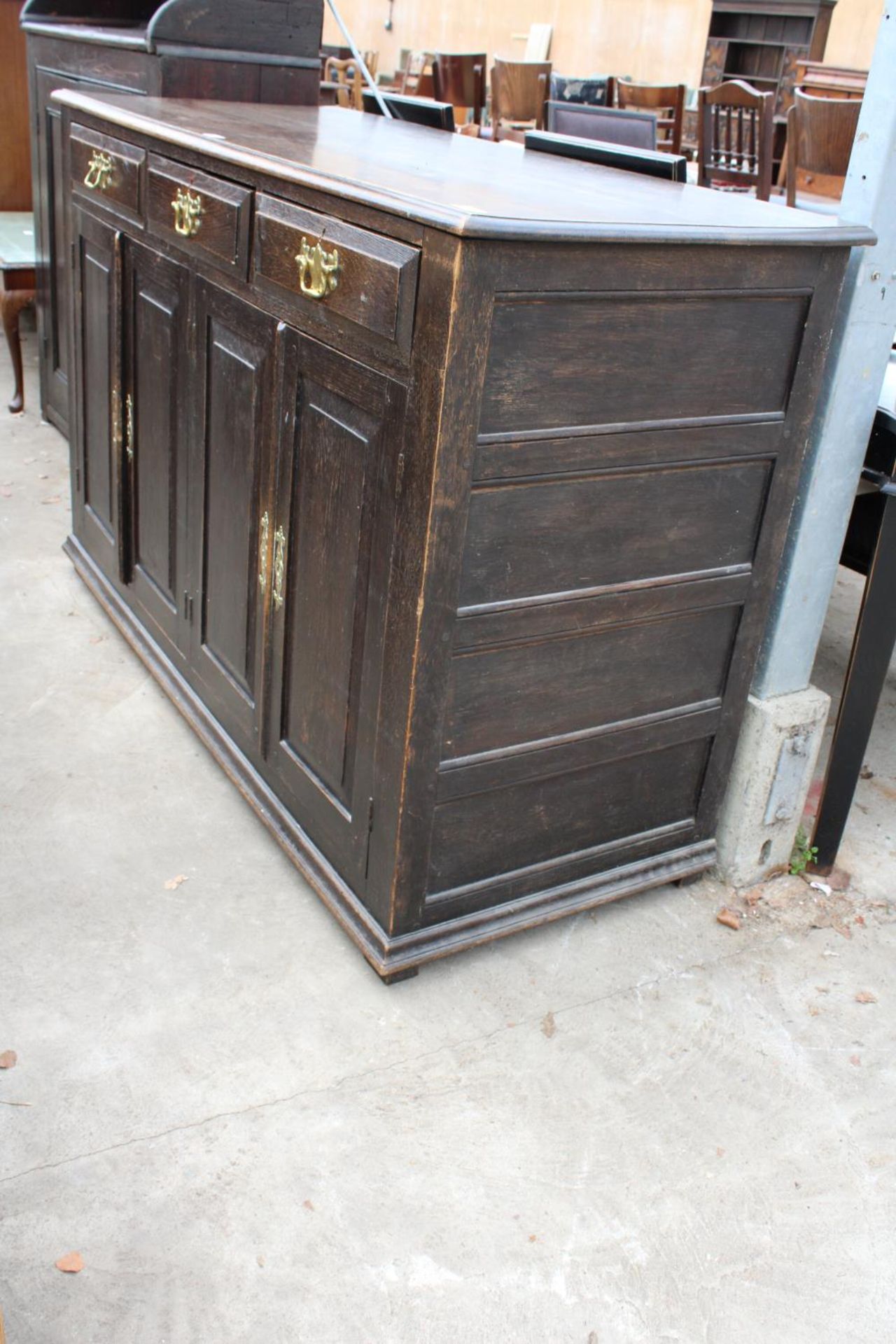 AN OAK GEORGE III STYLE DRESSER WITH FOUR CUPBOARDS AND THREE DRAWERS AND BRASS HANDLES, 60" WIDE - Image 2 of 4