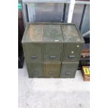 A GREEN METAL SECTIONAL FILING CHEST WITH SIX SECTIONS AND FRAME