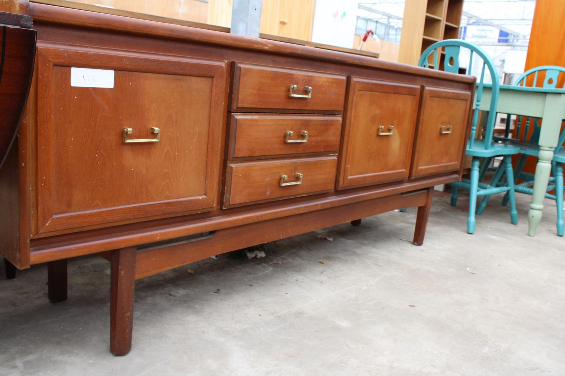 A RETRO TEAK SIDEBOARD ENCLOSING THREE DRAWERS AND THREE CUPBOARDS, 78" WIDE - Image 2 of 4