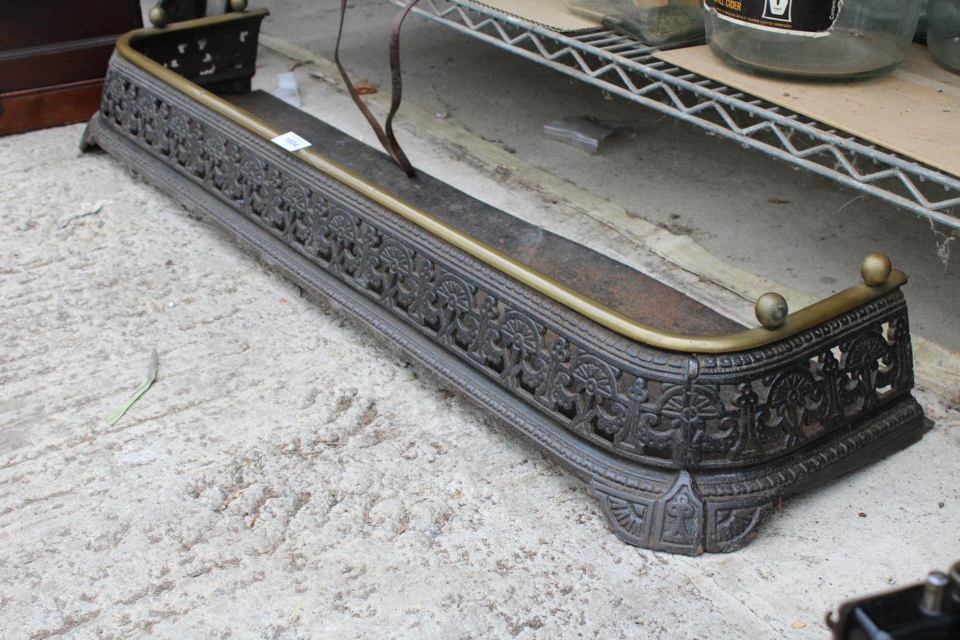 A VINATGE AND HEAVILY ORNATE CAST IRON FIRE FENDER WITH BRASS TRIM - Image 2 of 2