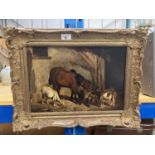 A GILT FRAMED OIL ON BOARD OF A HORSE IN A STABLE WITH TWO GOATS 11" X 15.5"