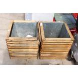 A PAIR OF WOODEN PLANTERS WITH GALVANISED LINERS